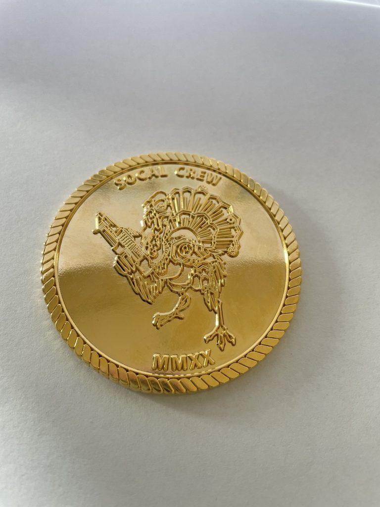 Shinny gold challenge coin